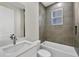 Stylish bathroom with a bathtub, modern fixtures, and tiled walls at 2258 Margaret Ln, North Port, FL 34286