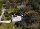 Aerial view showing home, pool, tennis court, and guest house on large lot at 2910 49Th St, Sarasota, FL 34234