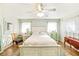 Well-lit bedroom with a bed, accent chair, dresser, and serene ambiance at 2910 49Th St, Sarasota, FL 34234