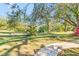 Landscaped pathway leading to a home with a large backyard at 2910 49Th St, Sarasota, FL 34234