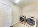 Laundry room with washer, dryer, and shelving at 3030 58Th E Way, Palmetto, FL 34221