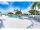 Inviting community pool with surrounding lounge chairs at 3430 Village Green Dr # 623, Sarasota, FL 34239