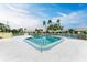 Sparkling community pool with surrounding patio at 3430 Village Green Dr # 623, Sarasota, FL 34239