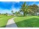 Community boasts lush landscaping, a pool, and a relaxing walkway at 3430 Village Green Dr # 623, Sarasota, FL 34239