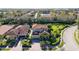House in a community with a lake and other homes at 3706 80Th E Dr, Sarasota, FL 34243