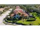 Aerial view of house with pool and lush landscaping at 3706 80Th E Dr, Sarasota, FL 34243