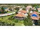 Aerial view of house, pool and surrounding homes at 3706 80Th E Dr, Sarasota, FL 34243