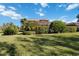 Large backyard with lush landscaping and spacious lawn at 3706 80Th E Dr, Sarasota, FL 34243