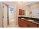 Bathroom with double vanity, granite countertop and tub at 3706 80Th E Dr, Sarasota, FL 34243
