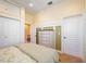 Light and airy bedroom with a queen-size bed and built-in dresser at 3706 80Th E Dr, Sarasota, FL 34243