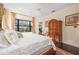 Primary bedroom with king bed and access to backyard at 3706 80Th E Dr, Sarasota, FL 34243
