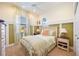 Cozy bedroom with a queen-size bed and built-in storage at 3706 80Th E Dr, Sarasota, FL 34243