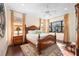 Bright bedroom with a large wooden bed and plenty of natural light at 3706 80Th E Dr, Sarasota, FL 34243