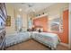 Twin bedroom with two beds and colorful decor at 3706 80Th E Dr, Sarasota, FL 34243