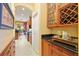 Butlers pantry with wine rack and ample storage at 3706 80Th E Dr, Sarasota, FL 34243