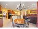 Charming dining area with a round table and chandelier at 3706 80Th E Dr, Sarasota, FL 34243