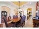 Formal dining room with a large wooden table and chandelier at 3706 80Th E Dr, Sarasota, FL 34243