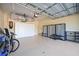 Garage with storage cabinets and room for bikes at 3706 80Th E Dr, Sarasota, FL 34243