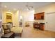 Bright landing area featuring a seating area and a built-in desk at 3706 80Th E Dr, Sarasota, FL 34243