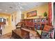 Bright living room with built-in shelving, comfortable seating, and a large window at 3706 80Th E Dr, Sarasota, FL 34243
