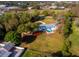 Aerial view showing single-story home, pool, and expansive backyard at 3825 Sarasota Golf Club Blvd, Sarasota, FL 34240