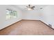 Large bedroom with tile flooring and a window overlooking the backyard at 3825 Sarasota Golf Club Blvd, Sarasota, FL 34240
