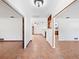 Bright entryway with terracotta tile floors and access to other rooms at 3825 Sarasota Golf Club Blvd, Sarasota, FL 34240