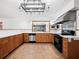 Modern kitchen featuring stainless steel appliances and wood cabinets at 3825 Sarasota Golf Club Blvd, Sarasota, FL 34240