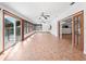 Sunroom with tile floors, sliding doors, and access to the pool at 3825 Sarasota Golf Club Blvd, Sarasota, FL 34240
