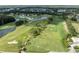 Aerial view of a golf course community with lush landscaping and water features at 3856 Trophy Blvd # 2, New Port Richey, FL 34655