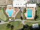 Aerial view of community pool and tennis courts at 3856 Trophy Blvd # 2, New Port Richey, FL 34655