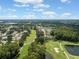 Aerial view showing houses surrounding a peaceful golf course at 3856 Trophy Blvd # 2, New Port Richey, FL 34655