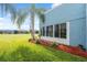 Backyard view of a condo with lush landscaping at 3856 Trophy Blvd # 2, New Port Richey, FL 34655
