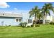 Condo with a backyard patio and palm trees at 3856 Trophy Blvd # 2, New Port Richey, FL 34655