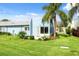 Light blue condo with a backyard patio at 3856 Trophy Blvd # 2, New Port Richey, FL 34655