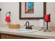Bathroom vanity with a sink and framed artwork at 3856 Trophy Blvd # 2, New Port Richey, FL 34655