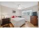 Bright bedroom with a double bed, dresser, and ceiling fan at 3856 Trophy Blvd # 2, New Port Richey, FL 34655