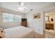Bedroom with a double bed, dresser, and view of the bathroom at 3856 Trophy Blvd # 2, New Port Richey, FL 34655