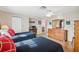 Spacious bedroom with two twin beds, dresser, and access to the bathroom at 3856 Trophy Blvd # 2, New Port Richey, FL 34655
