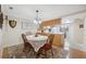 Charming dining area with a lace tablecloth and wood chairs at 3856 Trophy Blvd # 2, New Port Richey, FL 34655