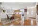 Open concept dining room with hardwood floors and kitchen access at 3856 Trophy Blvd # 2, New Port Richey, FL 34655