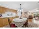 Bright dining room with kitchen and living room access at 3856 Trophy Blvd # 2, New Port Richey, FL 34655