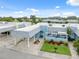 Light blue home with carport and landscaped yard at 3856 Trophy Blvd # 2, New Port Richey, FL 34655