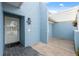 Front entry of condo with light blue walls and a white door at 3856 Trophy Blvd # 2, New Port Richey, FL 34655