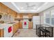 Well-equipped kitchen featuring white appliances and wood cabinets at 3856 Trophy Blvd # 2, New Port Richey, FL 34655