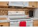 Modern kitchen with white appliances and marble countertops at 3856 Trophy Blvd # 2, New Port Richey, FL 34655
