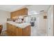Modern kitchen with light wood cabinets and marble countertops at 3856 Trophy Blvd # 2, New Port Richey, FL 34655