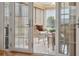 Bright sunroom with wicker furniture and access to the backyard at 3856 Trophy Blvd # 2, New Port Richey, FL 34655