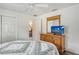 Bedroom with wood dresser and large flat-screen TV at 4035 Keats Dr, Sarasota, FL 34241