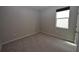 Simple bedroom with gray walls, carpeting, and a window with blinds at 4109 Quiet Rain Ct, Palmetto, FL 34221